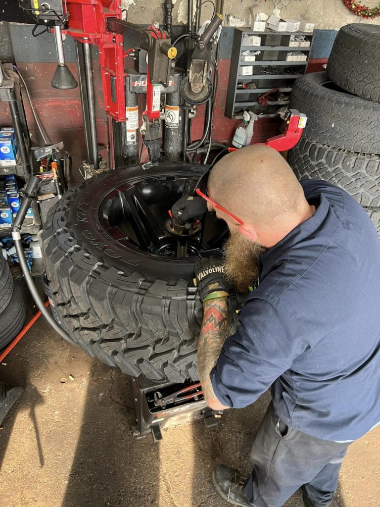 man working on tire